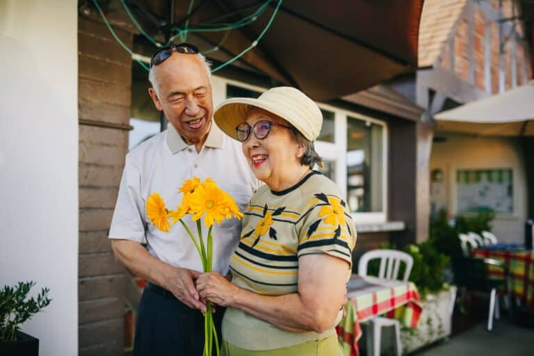 Man giving woman flowers