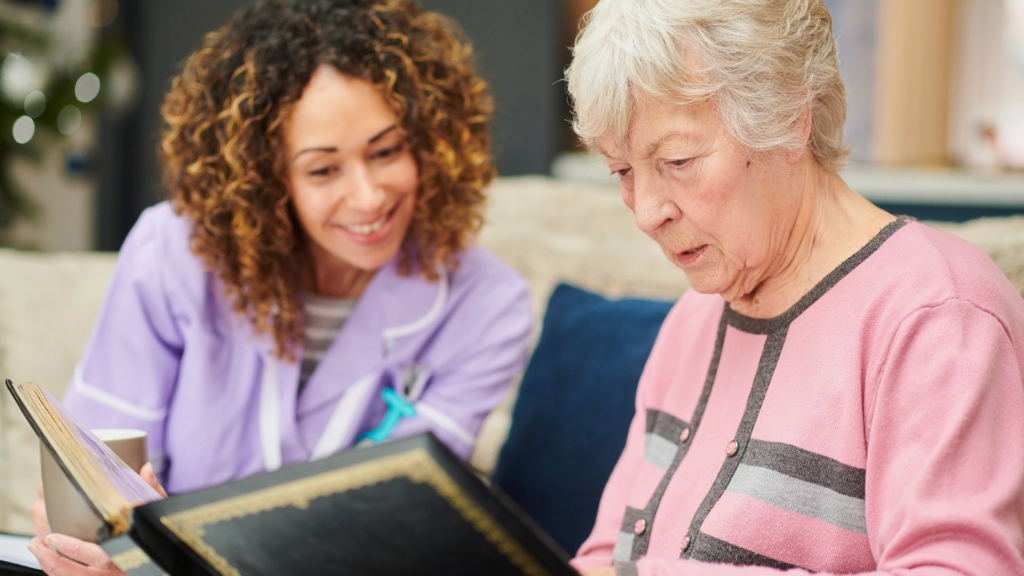 In-home senior care agency companion reading to senior