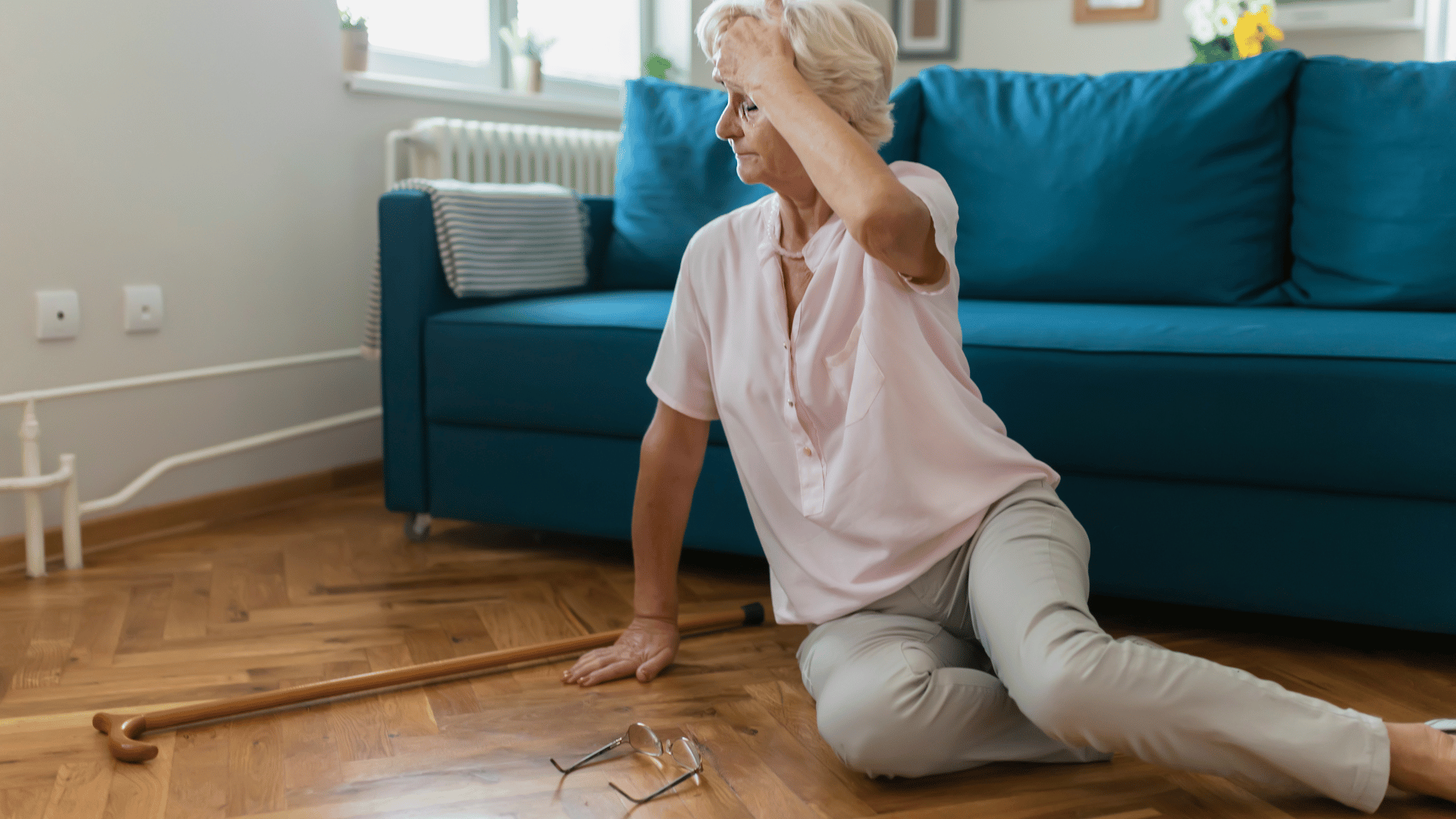 An elderly woman on the floor of her home after a fall