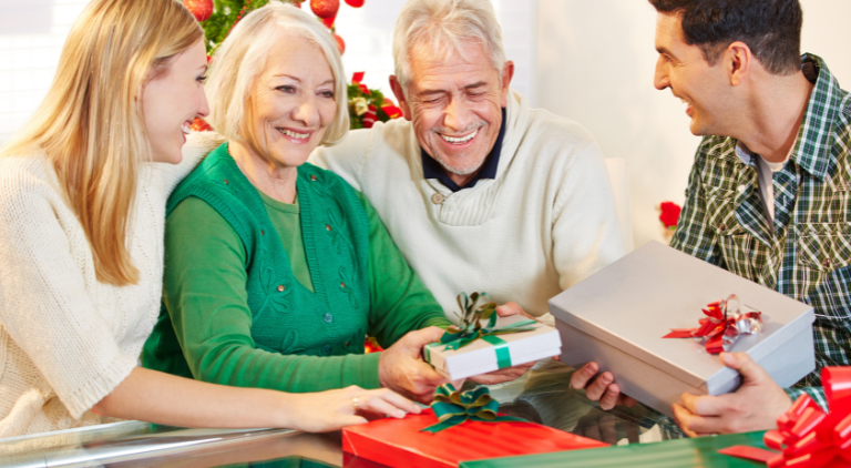 two seniors receiving a gift for the holiday