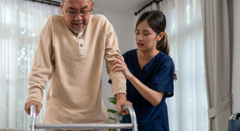 A helper assisting the elderly