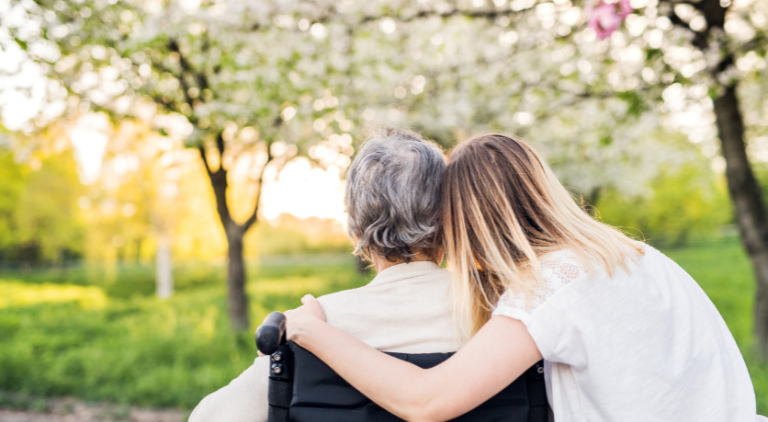 Family member hugging grandparent